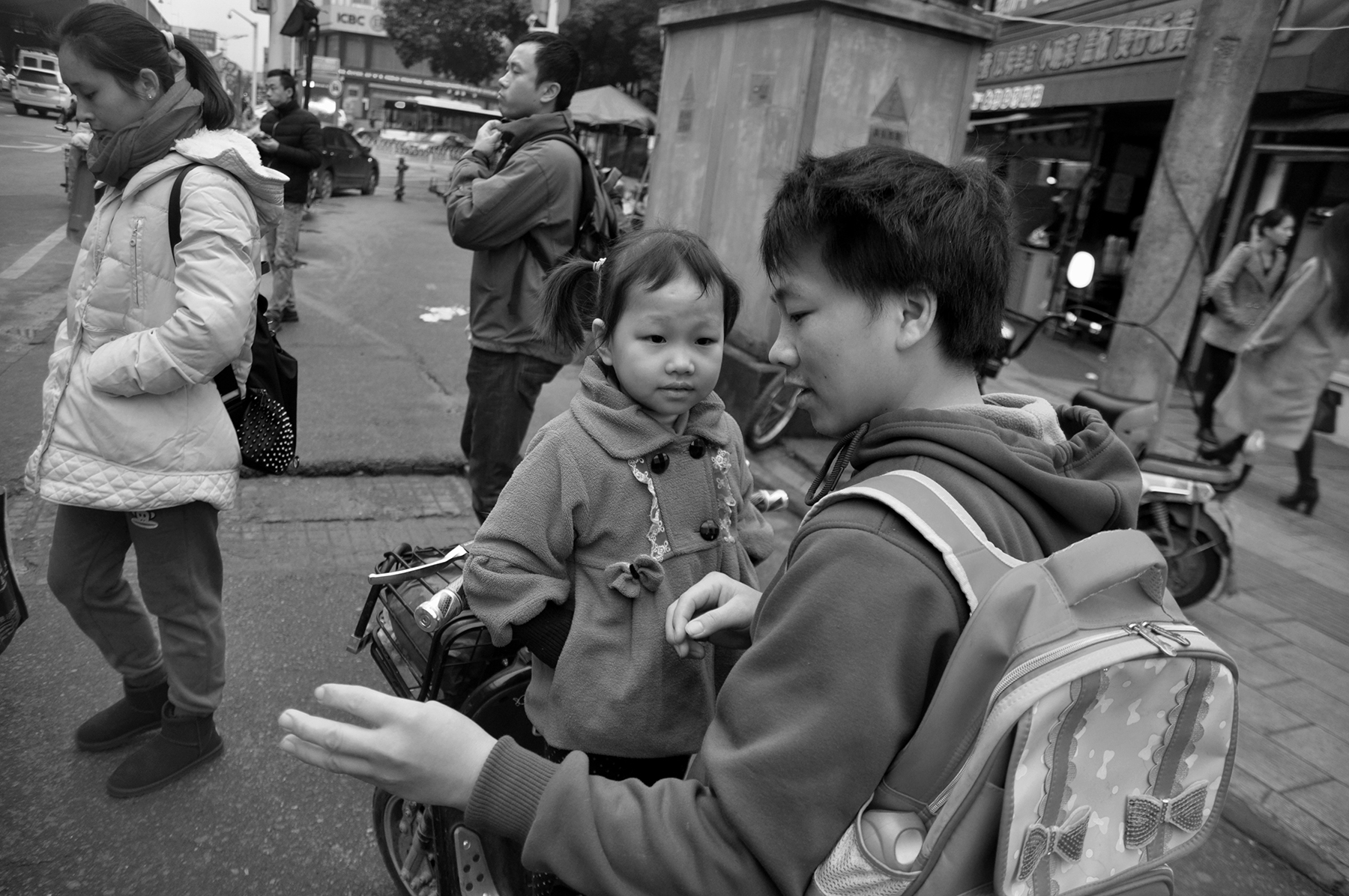 Father taking daughter to school, Wuhan