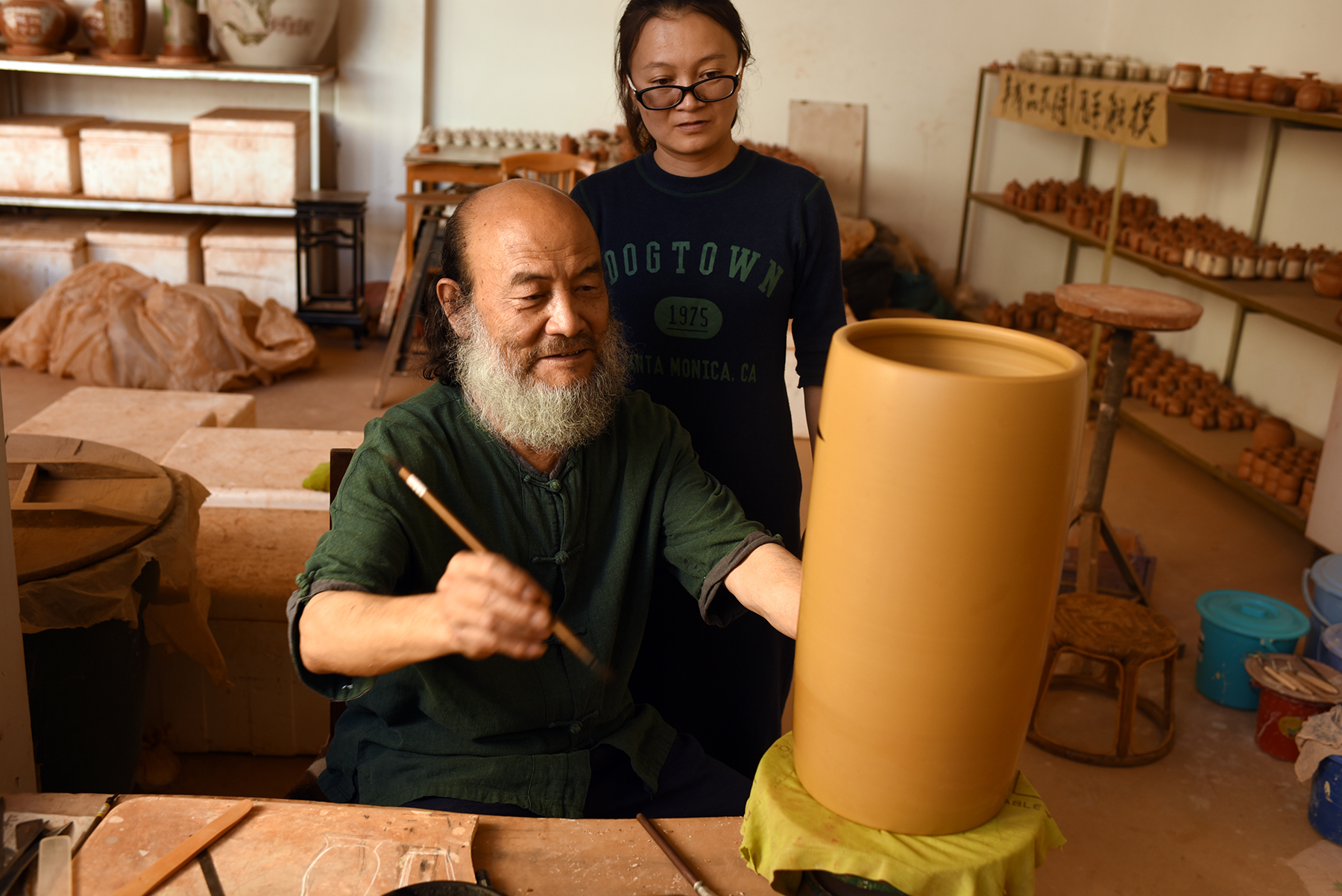  Tan Zhi Fan,&nbsp;Inheritor of Purple Pottery Intangible Cultural Heritage, with his daughter.&nbsp;Jianshui, Yunnan Province. 