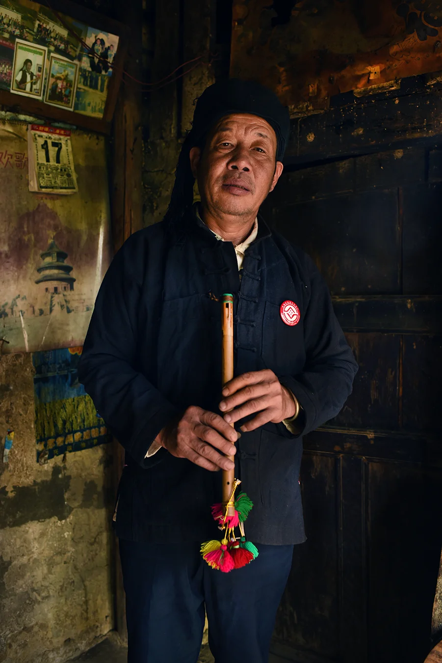 Inheritor Chen Eduo with his Ba Wu wind instrument. Puchun village, Yunnan 2017.