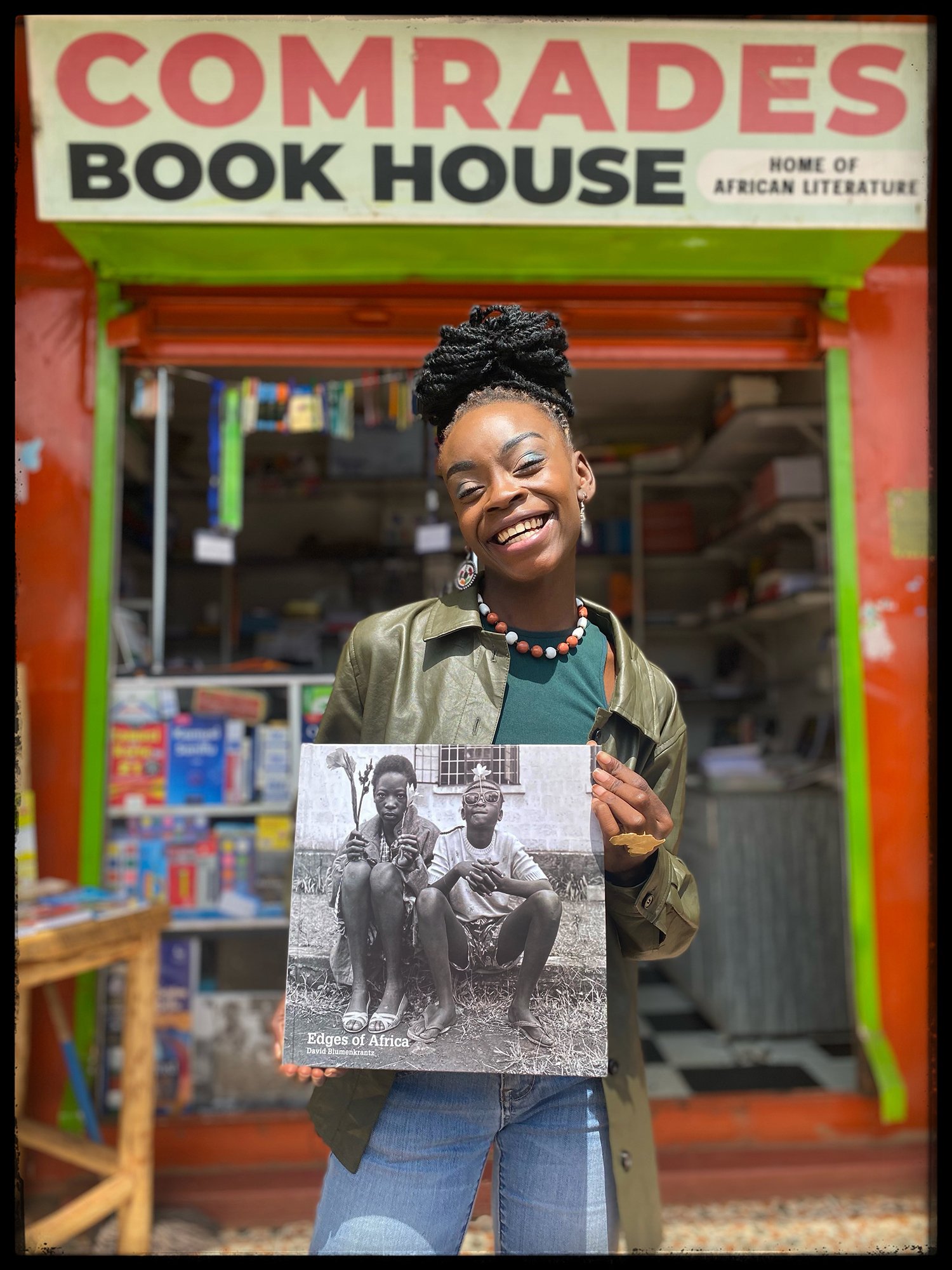  Miss Okumu, at Comrades Book House, Mwimuto 