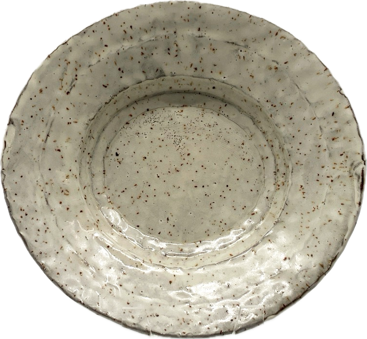 shallow oval press-molded bowl, white with brown spots