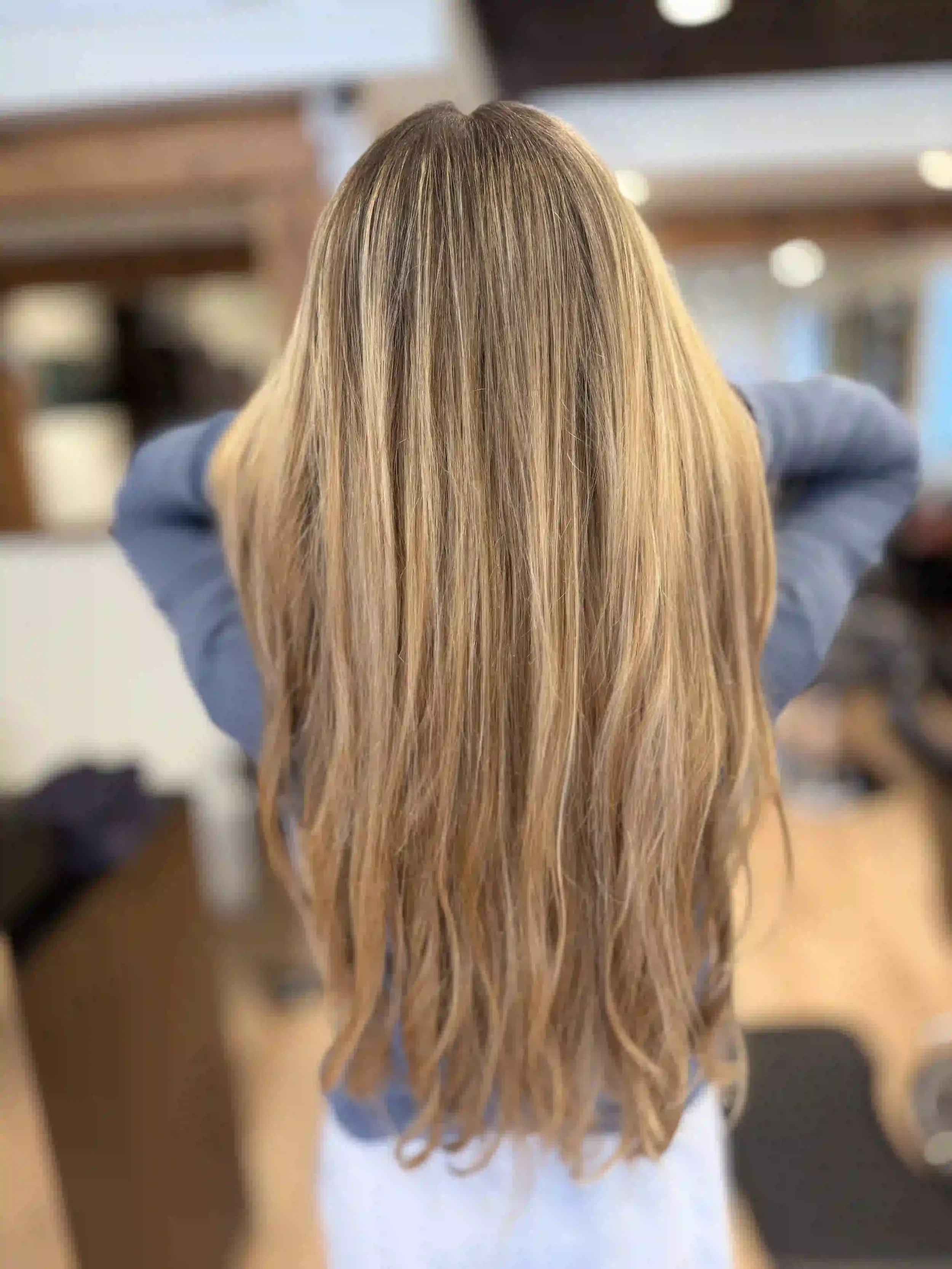 Long natural blonde balayage with soft, beachy texture and lived-in dimension, styled by Mars at Chroma Salon Seattle.