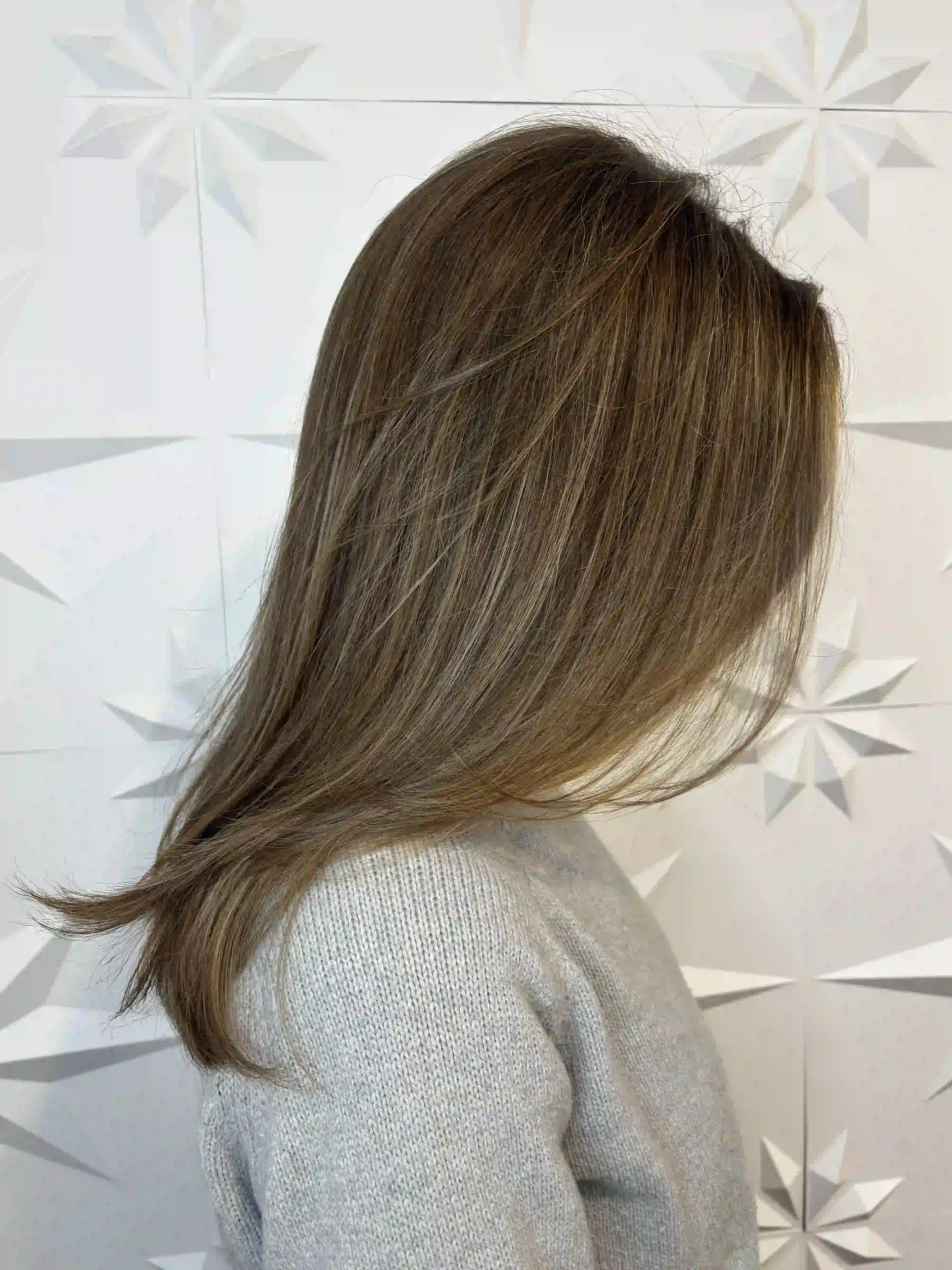 Long layered brunette hair with a soft, voluminous blowout and natural movement, styled by Alpin at Chroma Salon Queen Anne Seattle for a smooth, effortless finish.