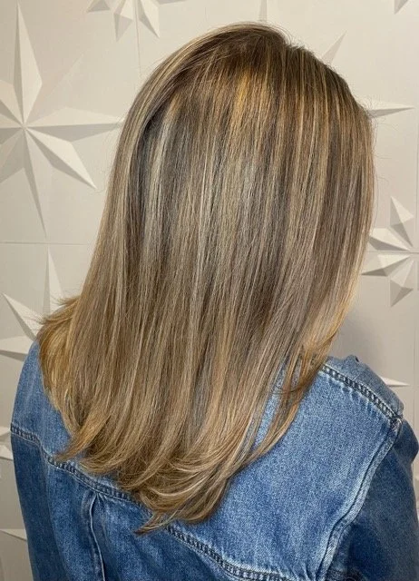Soft beige blonde balayage with seamless root blend and layered cut, created at Chroma Salon Seattle using professional Aveda hair color.