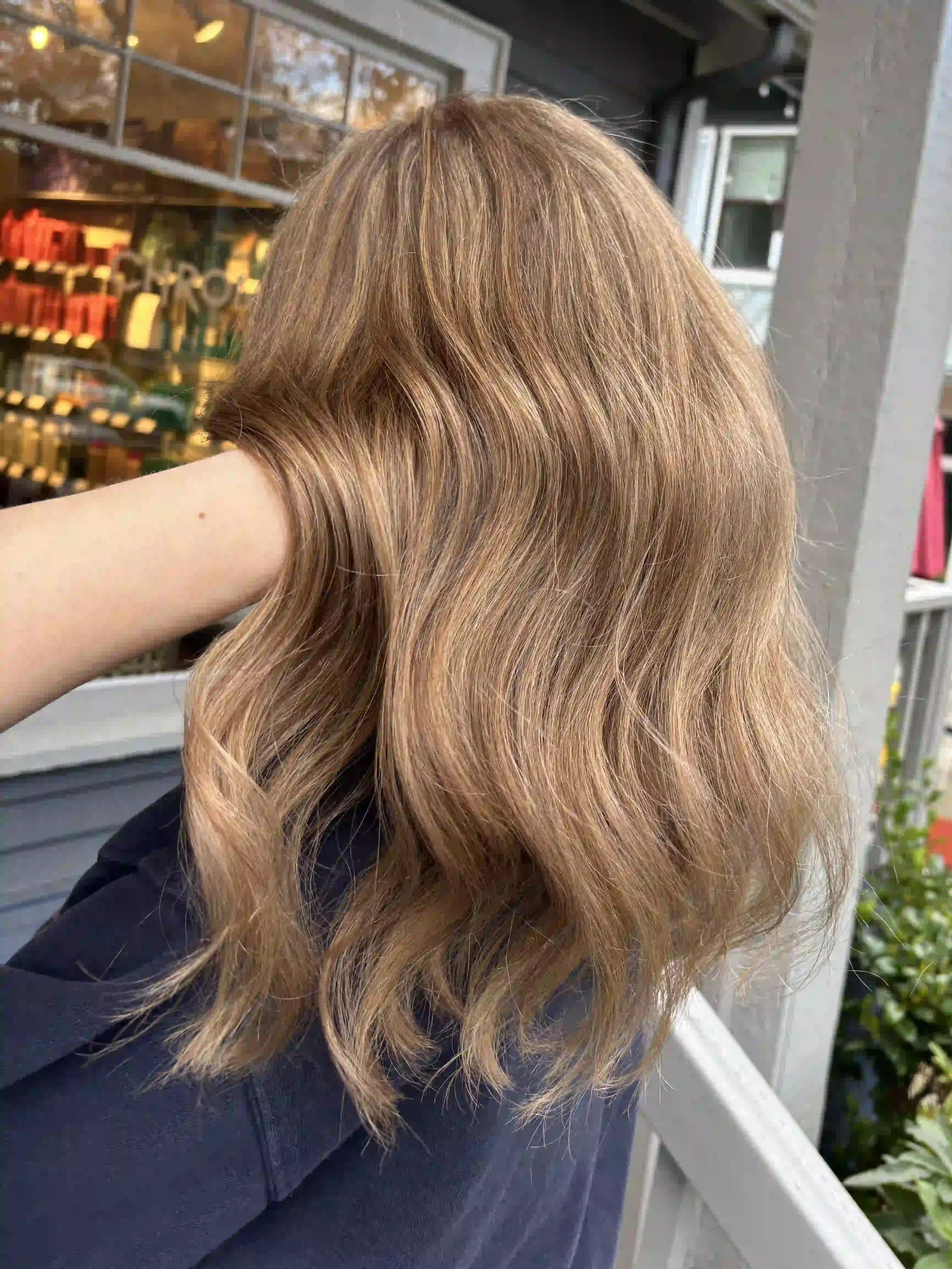 Beige blonde balayage with soft, natural waves and a seamless blend, created by Alpin at Chroma Salon Seattle for bright, low-maintenance dimension.