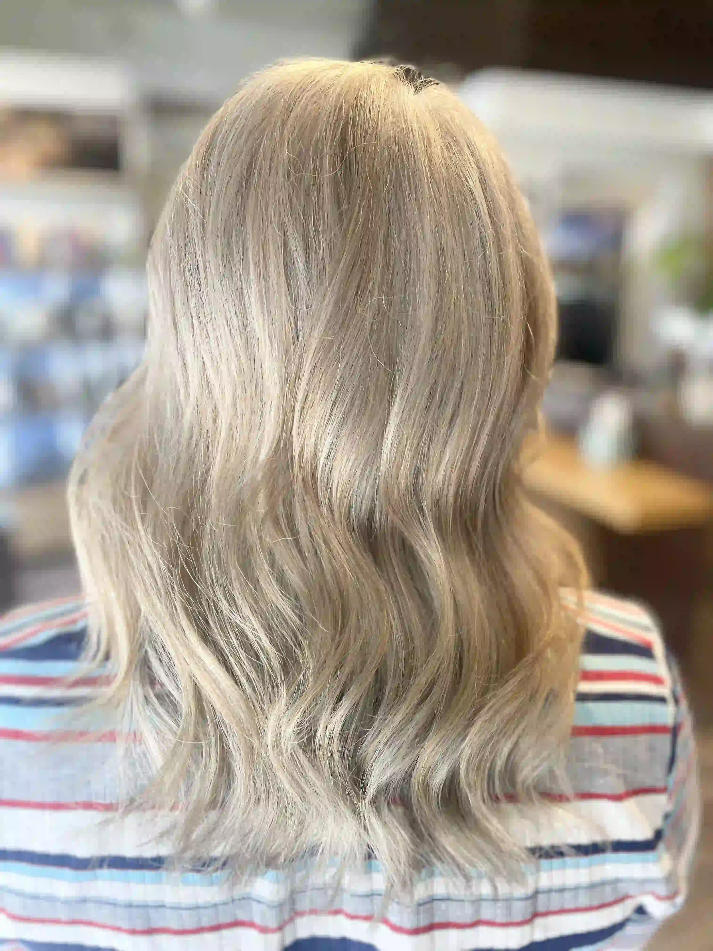 Cool beige blonde lob with soft lived-in waves and dimensional highlights, styled by Anna at Chroma Salon Wallingford Seattle.