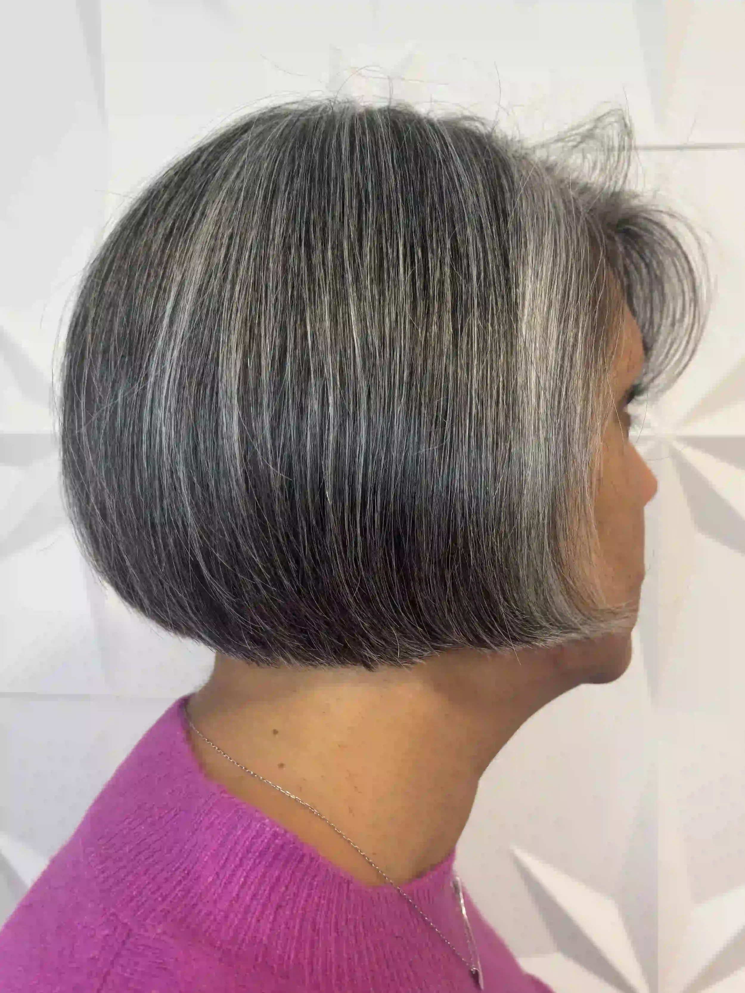 Short gray bob with a sleek, rounded shape and smooth finish, styled by Alpin at Chroma Salon Queen Anne Seattle for a polished, modern look.