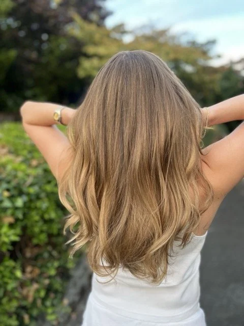 Balayage highlights and soft waves created at Chroma Salon Seattle. Our expert stylists specialize in natural-looking hair color, dimension, and shine for clients seeking the best hair salon in Seattle.