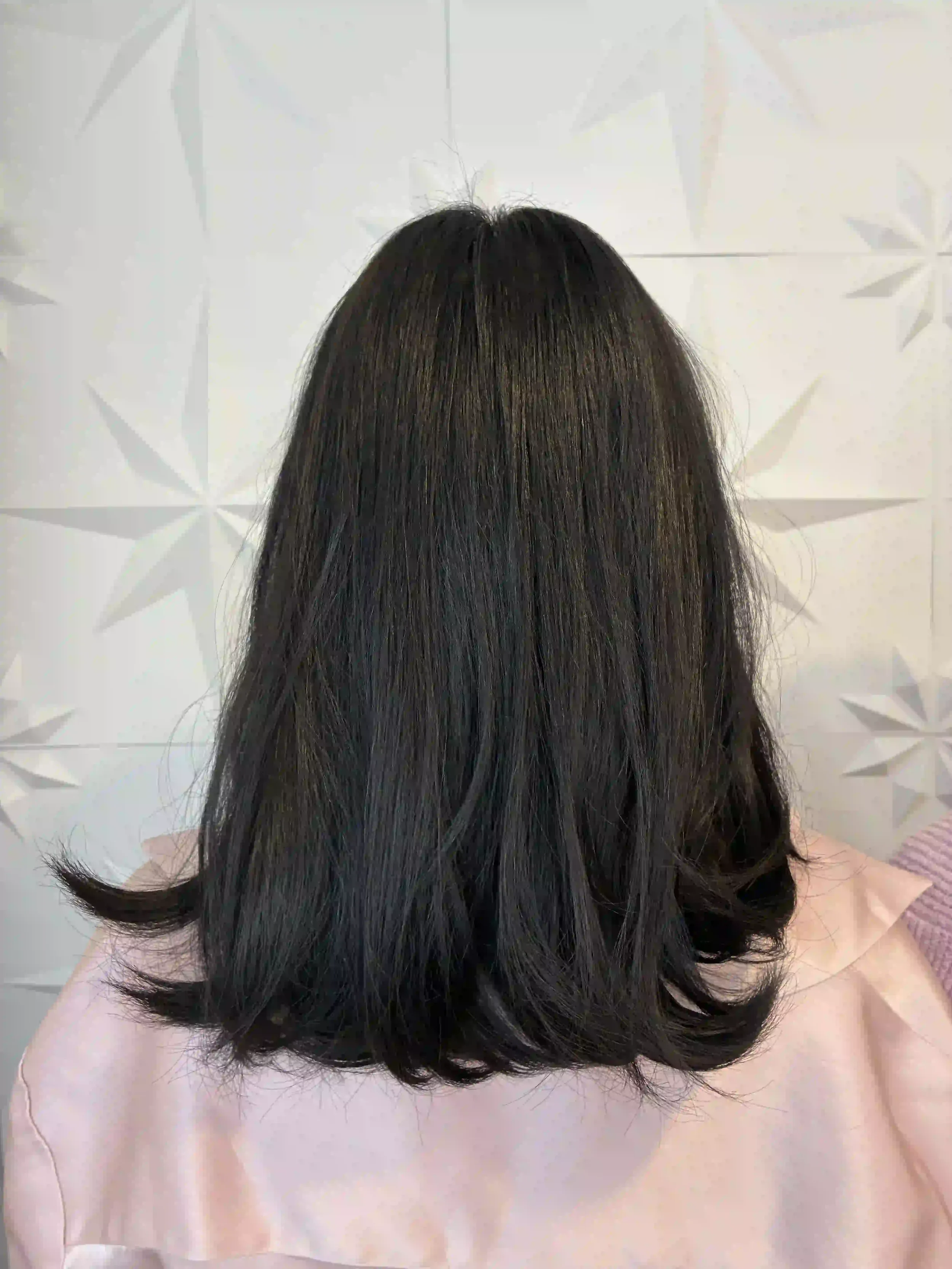Shoulder-length dark brunette hair with soft layers and a smooth, polished finish, created by Peter at Chroma Salon Queen Anne Seattle for natural shine and movement.