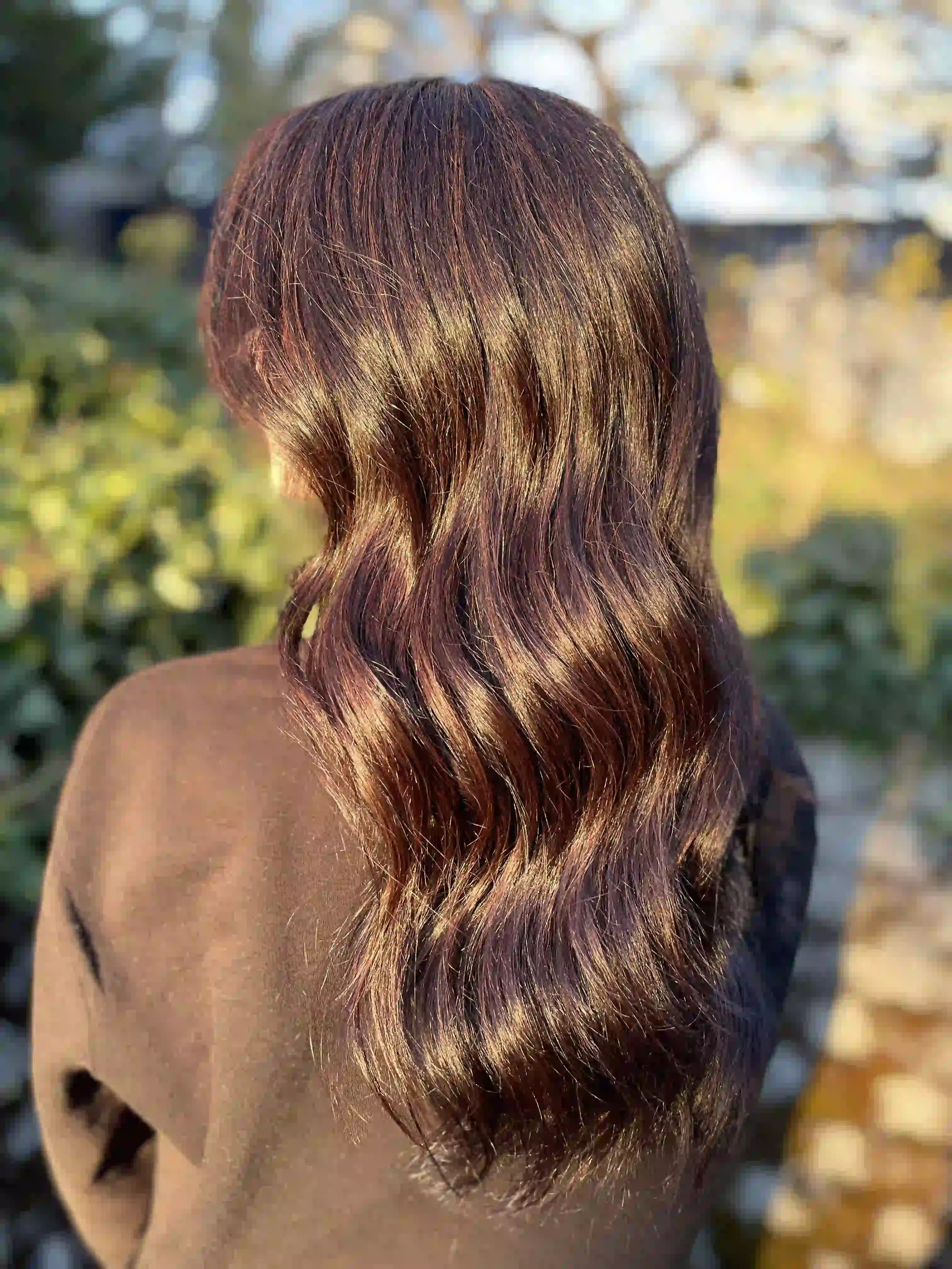 Rich espresso brunette hair with glossy soft waves and dimensional shine, styled by Anna at Chroma Salon Wallingford Seattle.