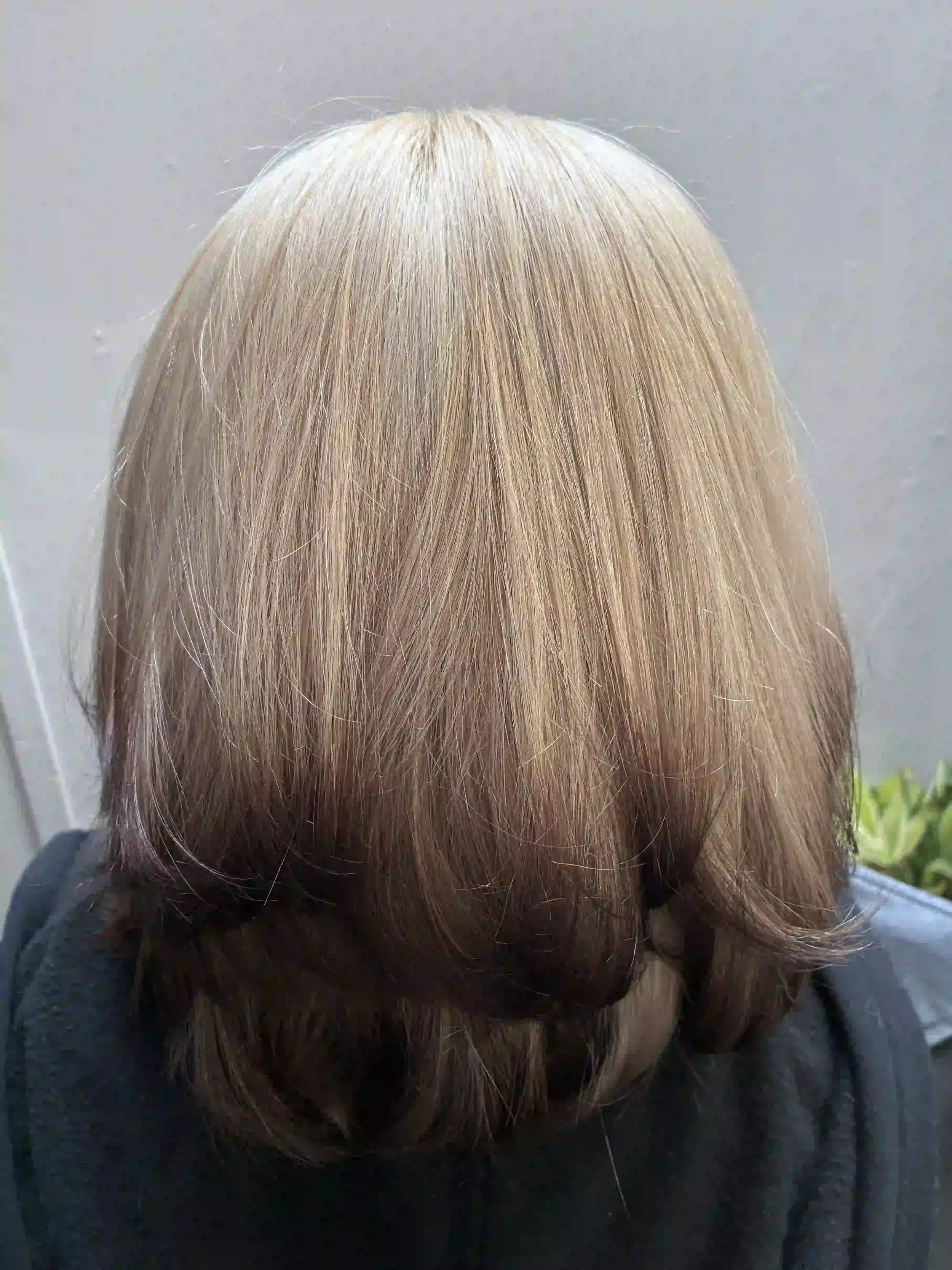 Soft beige blonde hair with long layers and a smooth, blended finish, created by Peter at Chroma Salon Queen Anne Seattle for natural shine and dimension.