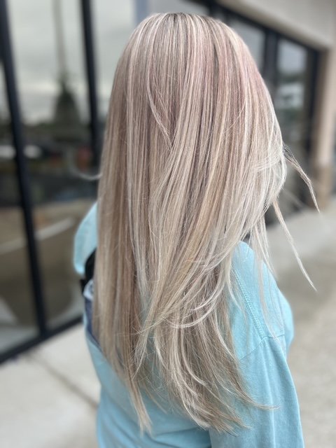Cool platinum blonde balayage with long layers and a seamless root blend, created at Chroma Salon Seattle for bright, dimensional blonding.