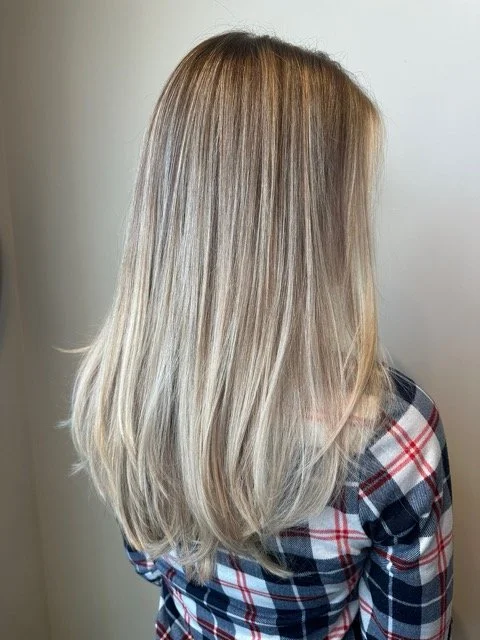 Dimensional blonde balayage with bright ends and soft layers, created at Chroma Salon using professional Aveda blonding techniques.