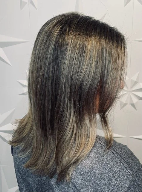 Cool-toned ash blonde balayage with shadow root and layered haircut, created at Chroma Salon Seattle using professional Aveda hair color.