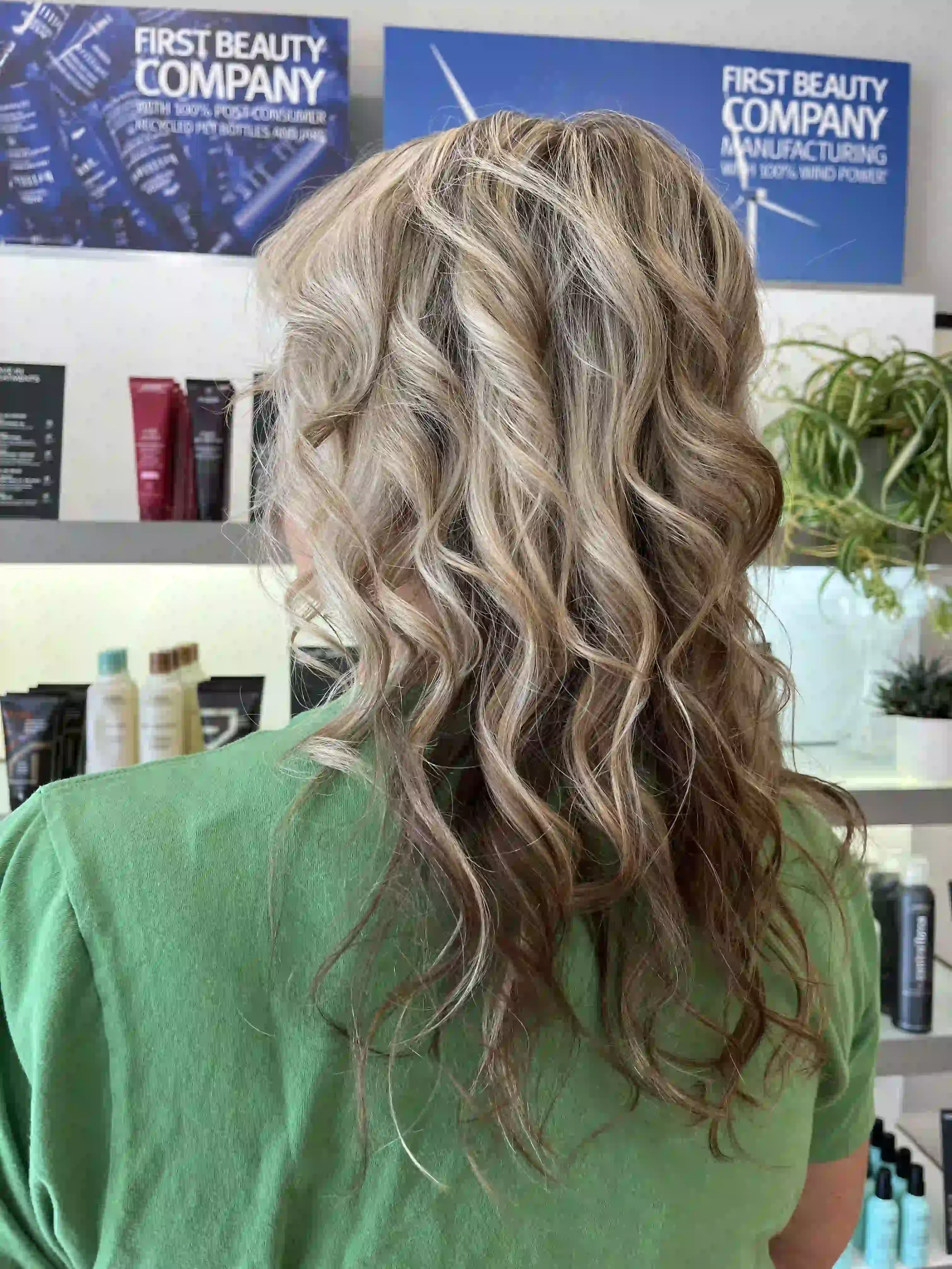 Dimensional blonde balayage featuring bright ribbon highlights, a softly blended shadow root, and a seamless transition into cool beige and creamy blonde tones. The lived-in color placement creates depth at the root while maintaining brightness throu