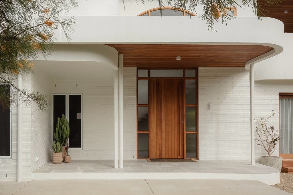 Brunswick House - This design blends graceful curves with simple lines, paying tribute to early Brunswick architecture while incorporating contemporary style. The exterior has smooth, flowing shapes that create a sense of movement, making it inviting