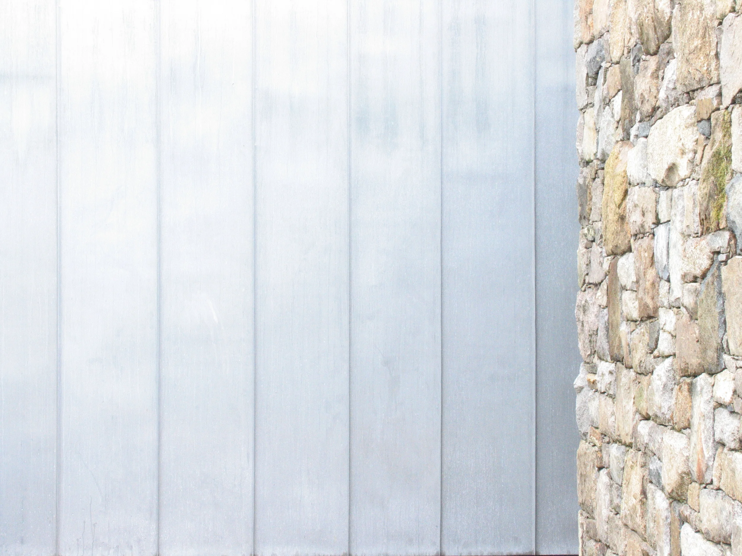 stone and zinc cladding weathering nicely
