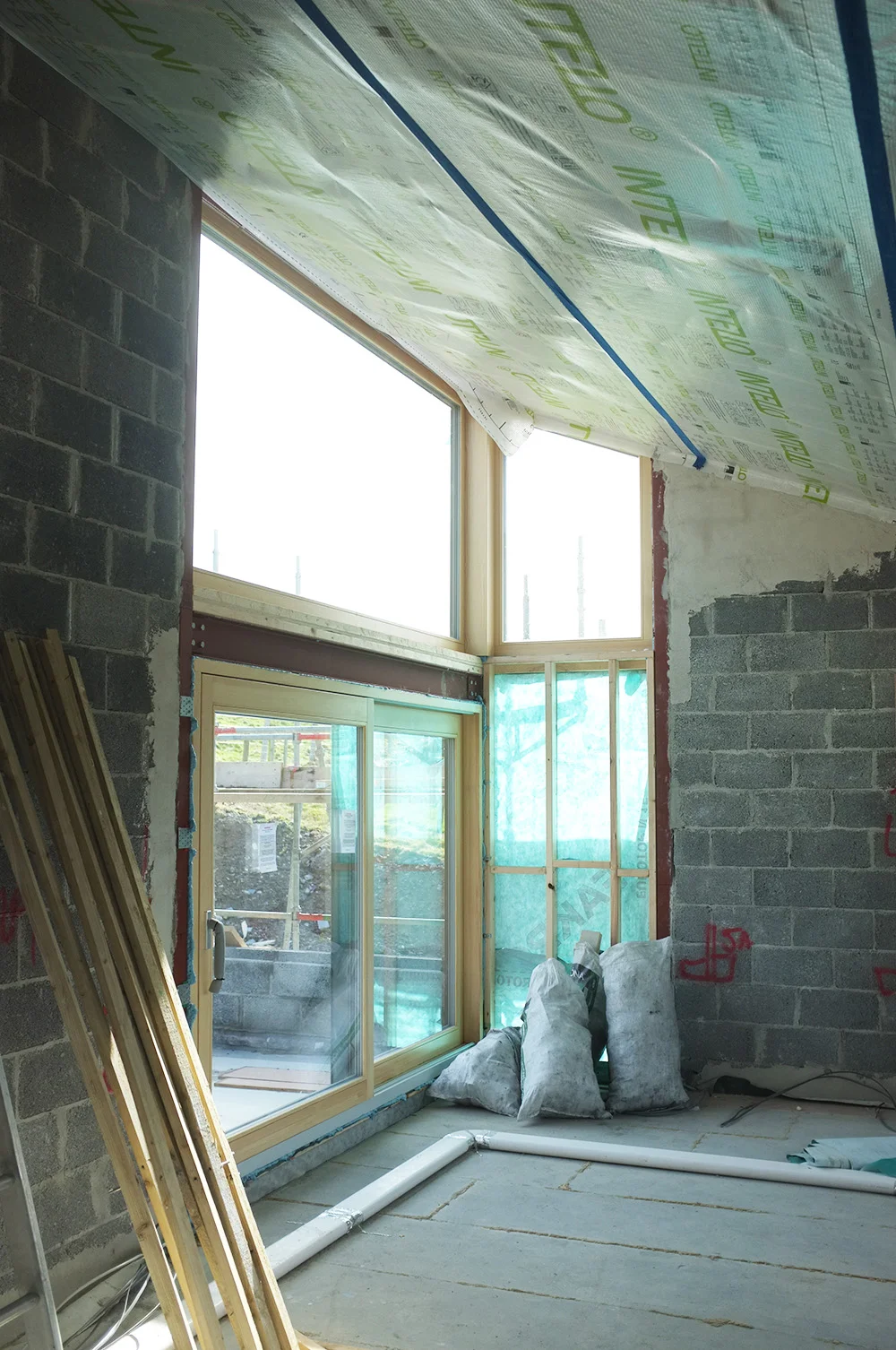 Alu-Clad windows finished with black aluminium frames externally and timber soft-wood internally