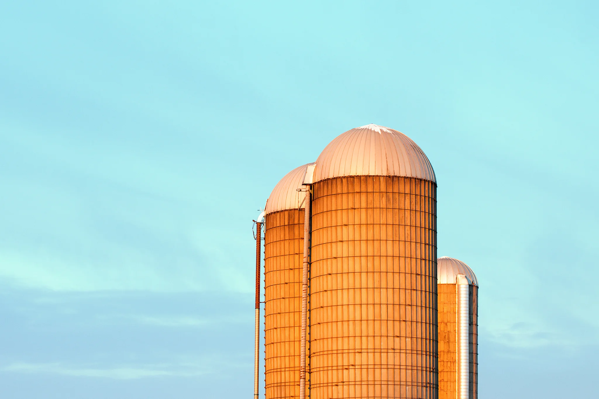 A trio of farm silo illuminated by the morning light somewhere near Mount Horeb, Wisconsin . → Buy a Print