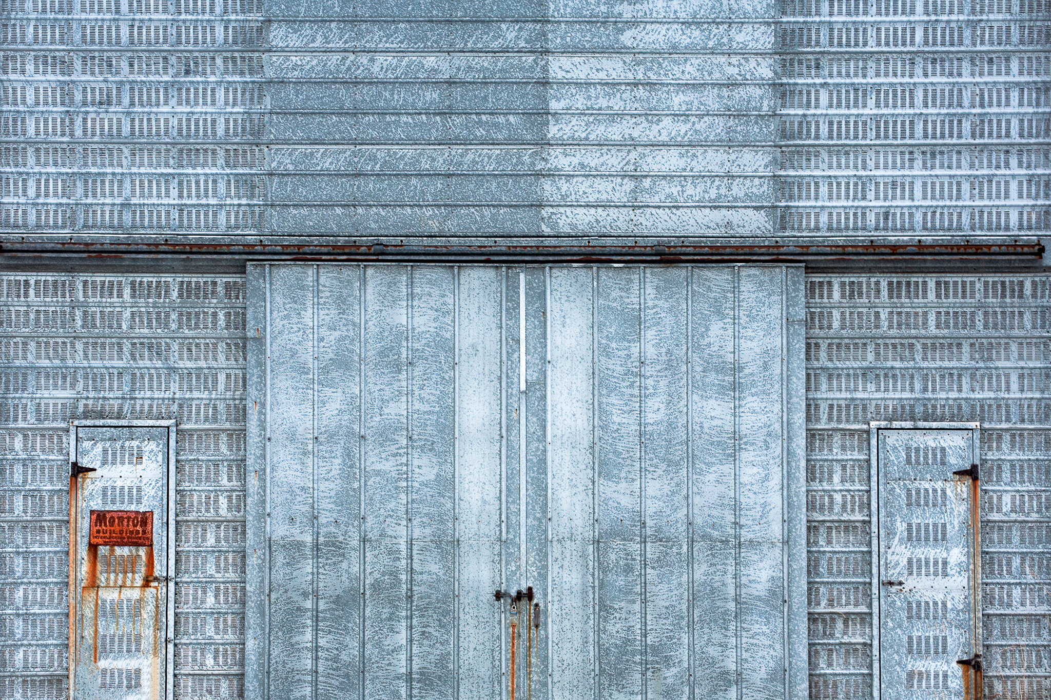 The side of an old metal corn crib somewhere outside of Mount Horeb, Wisconsin.&nbsp;&nbsp;→ License Photo