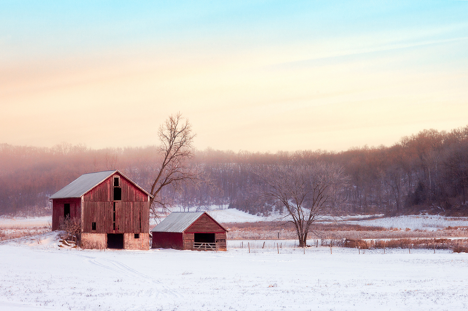 An old barn and shed grace this early morning, snowy, rural scene somewhere outside of Mount Horeb, Wisconsin.&nbsp;→ Buy This Print