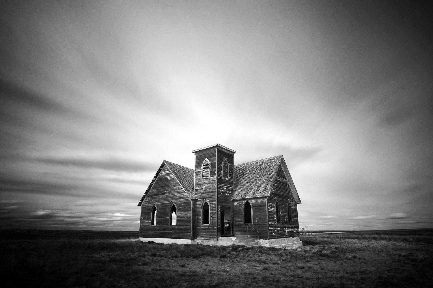 An old, abandoned church in the middle of the sprawling plains north and west of Kremlin, Montana. Formerly known as the Milk River Valley Church.&nbsp;→ Buy a Print