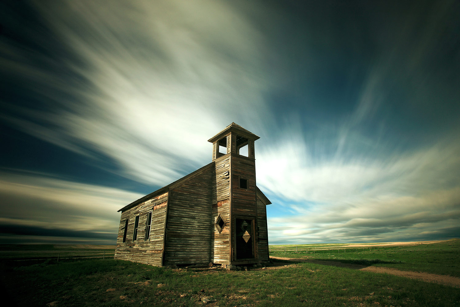 The old Cottonwood Lutheran church is abandoned on what is now pasture land north of Havre, Montana.&nbsp;→ Buy a Print