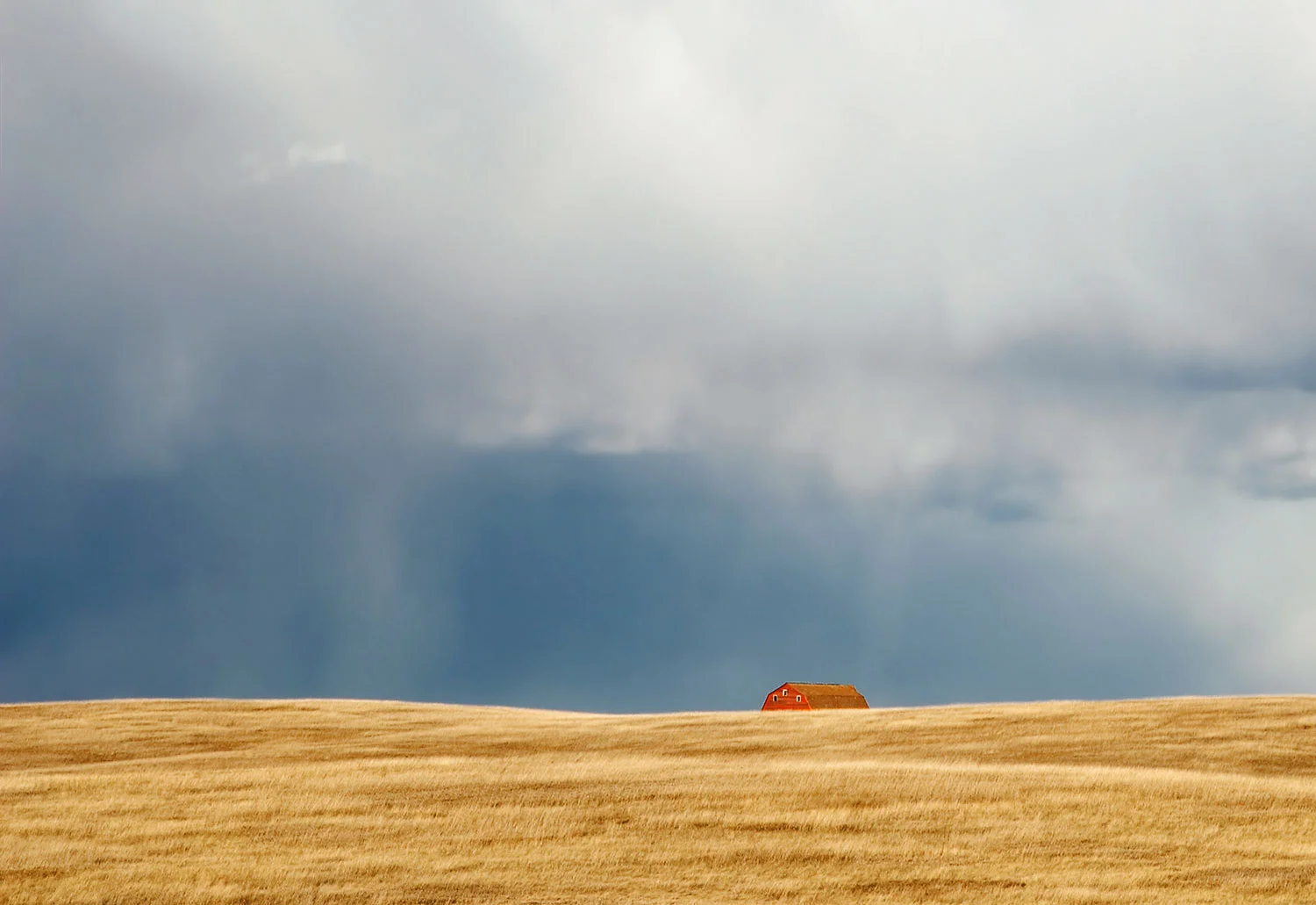 A storm looms large over the horizon somewhere on the plains of South Dakota. → Buy a Print