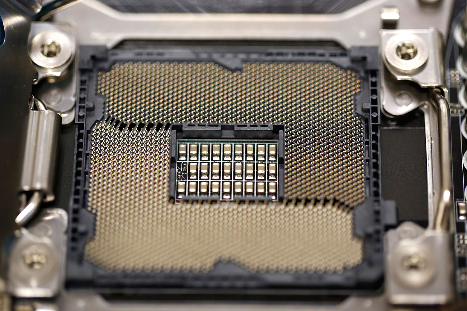 A close-up of all the many pins and connection points on the microprocessor socket.