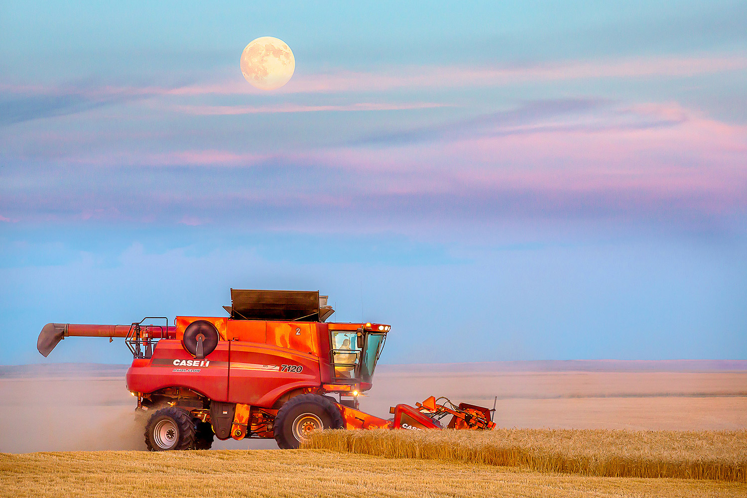 The Super Moon rises over the wheat fields as farmers work late cutting wheat north of Havre, Montana.&nbsp;→ Buy a Print