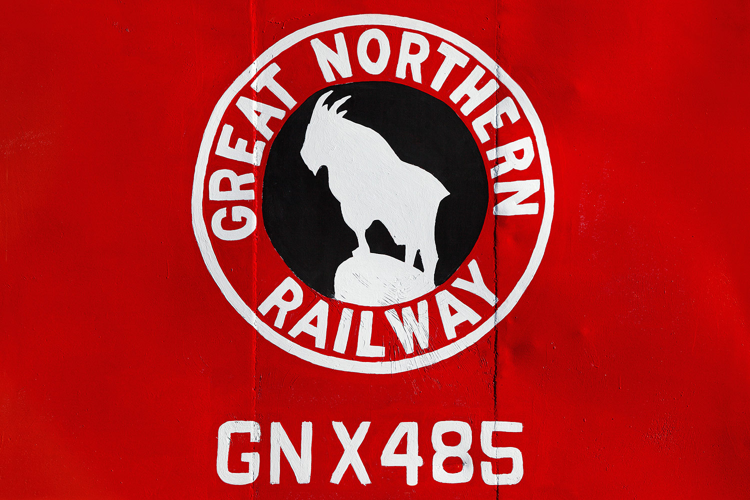 A close-up of the Great Northern Railway logo on the side of a red caboose in Havre, Montana.&nbsp;→ Buy a Print
