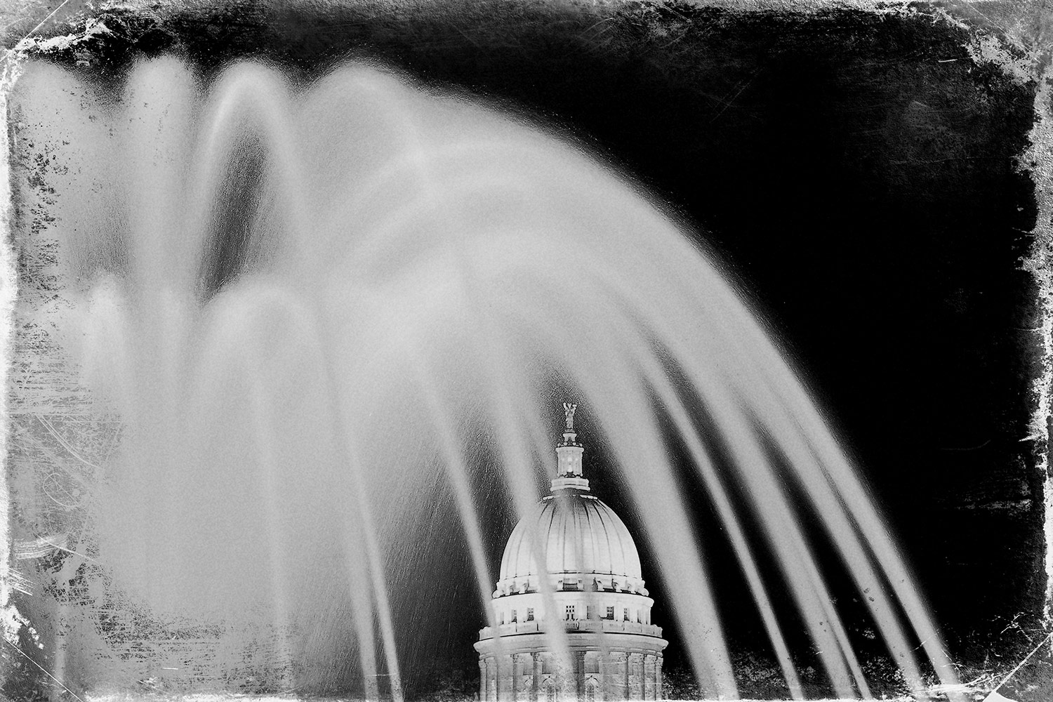 An old fashioned photo of the Wisconsin State Capitol in Madison, Wisconsin with a rough, stained look.&nbsp;→ Buy a Print
