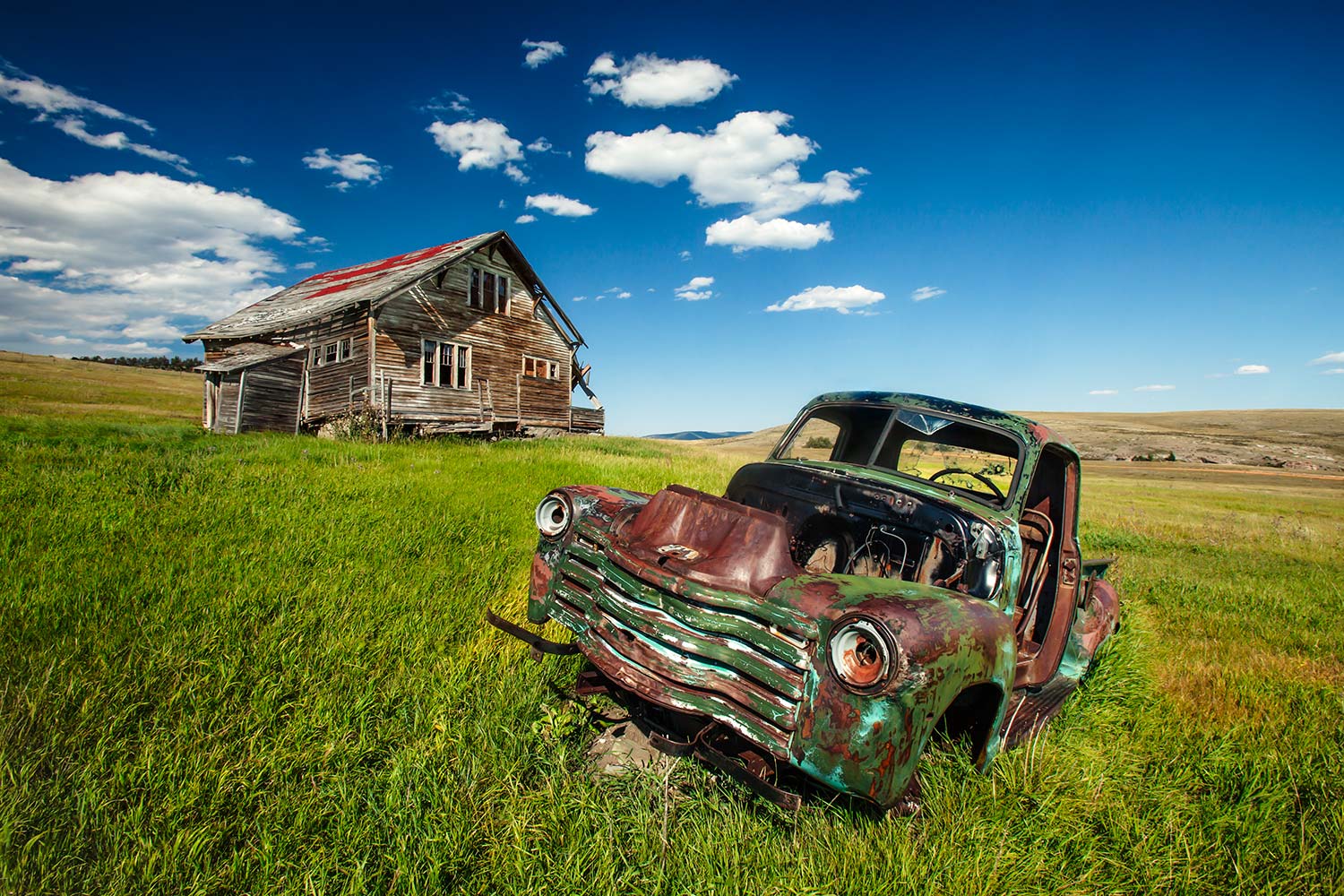 An old house and a rotting jalopy near Lingshire, Montana.&nbsp;→ Buy a Print&nbsp;or License Photo