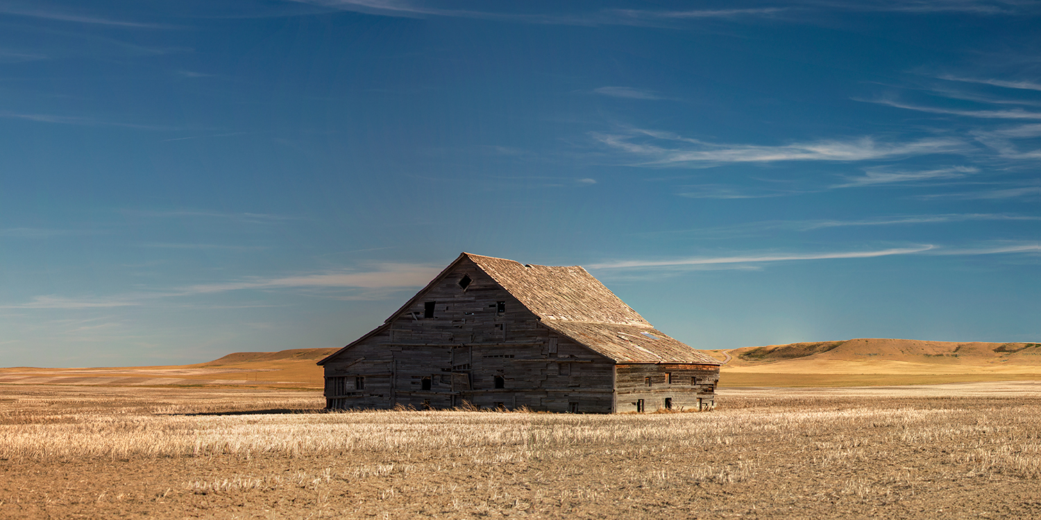 A aging old barn stands alone in a field east of Choteau, Montana.&nbsp;→ Buy a Print&nbsp;or License Photo