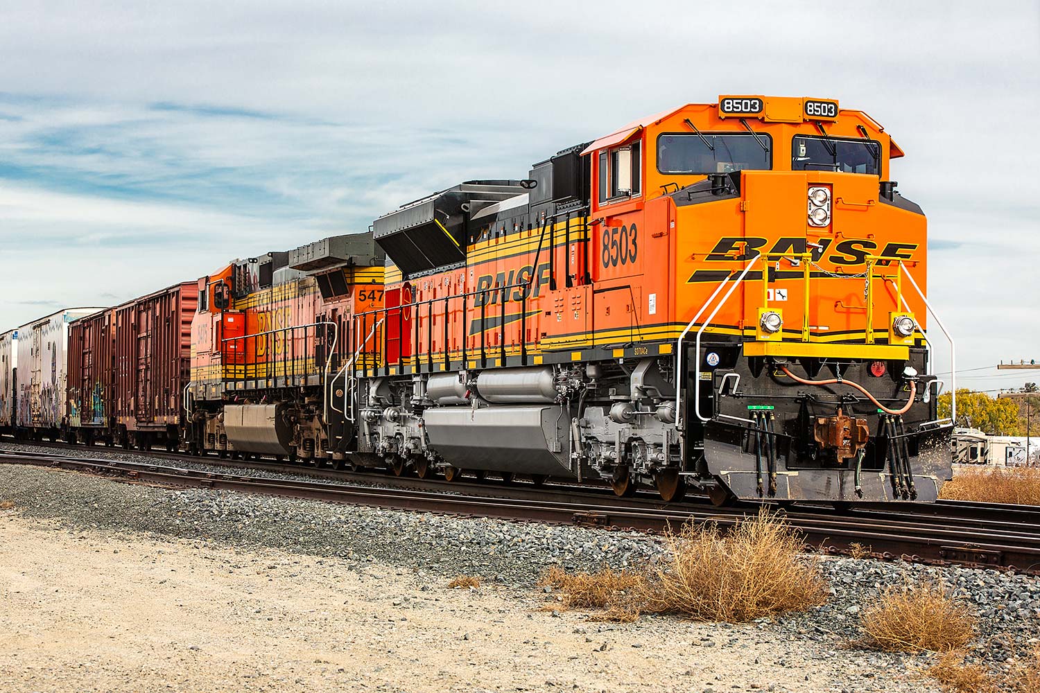 A BNSF Railways locomotive chugs on through the industrial district in Billings, Montana.
