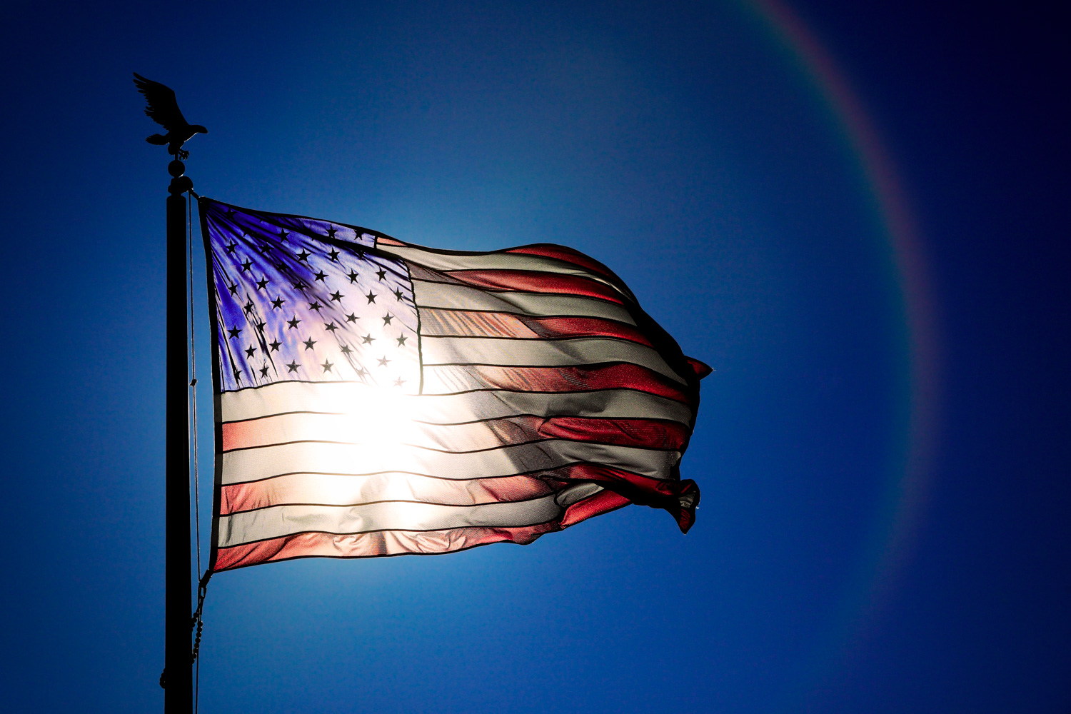 Photos-Sun-Shining-Through-American-Flag.jpg