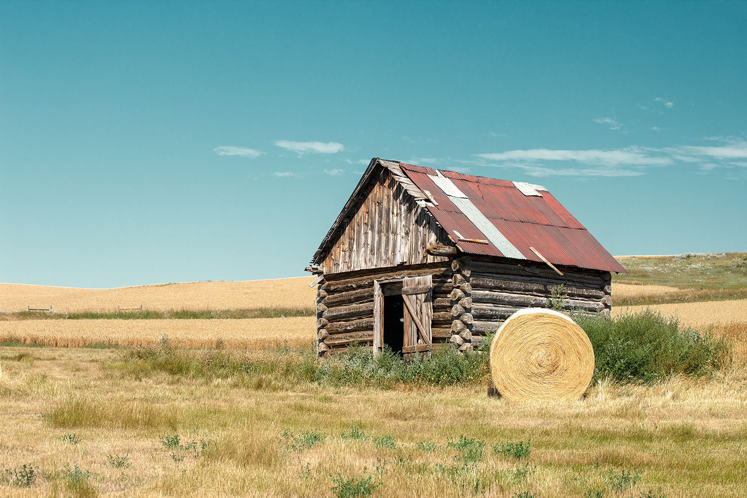  An old log shed on the quiet western plains outside of Winifred, Montana.   → Buy a Print   or   License Photo   