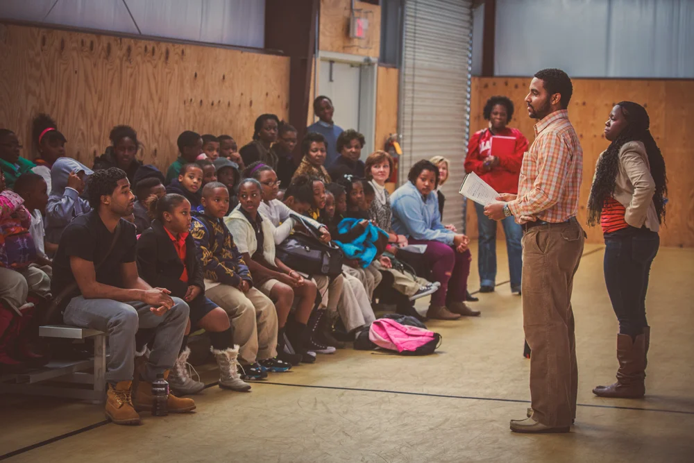 Coach Justin reminding students about the "house rules" on the first day back in the After School Program for Common Ground Montgomery.
