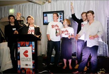The Raise the Bar crew accepts a SMAC award