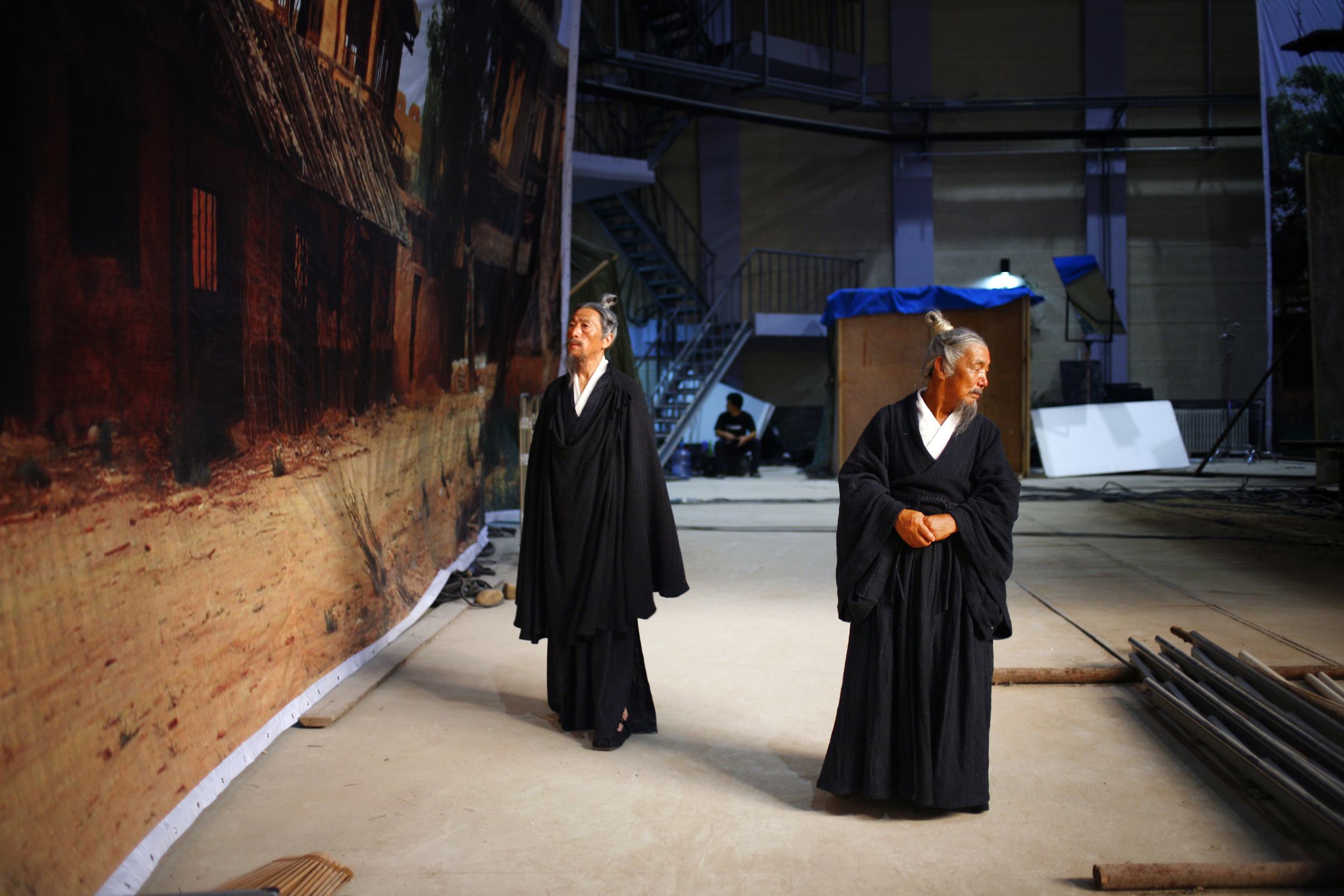 Extras exploring a sound stage.