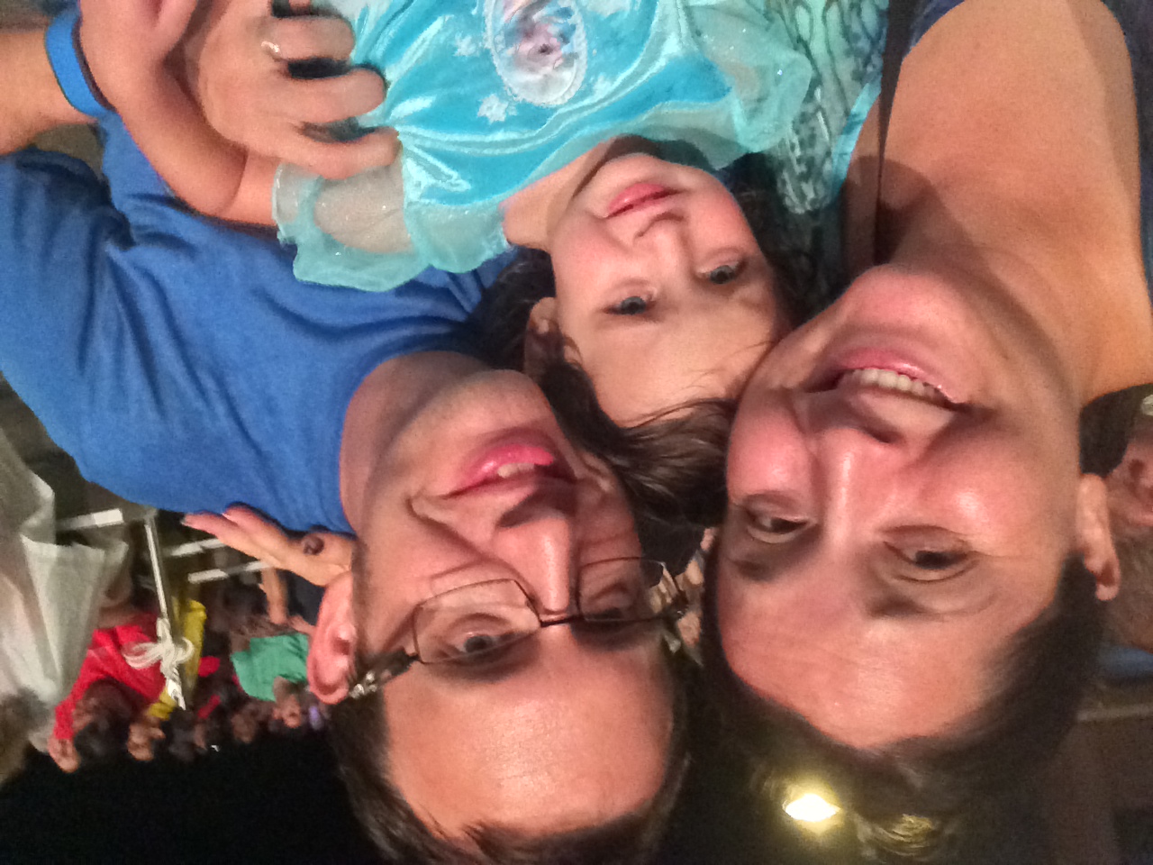 Getting drizzled on waiting for Fantasmic (awkward uncomfortable attempts at grinning through it)