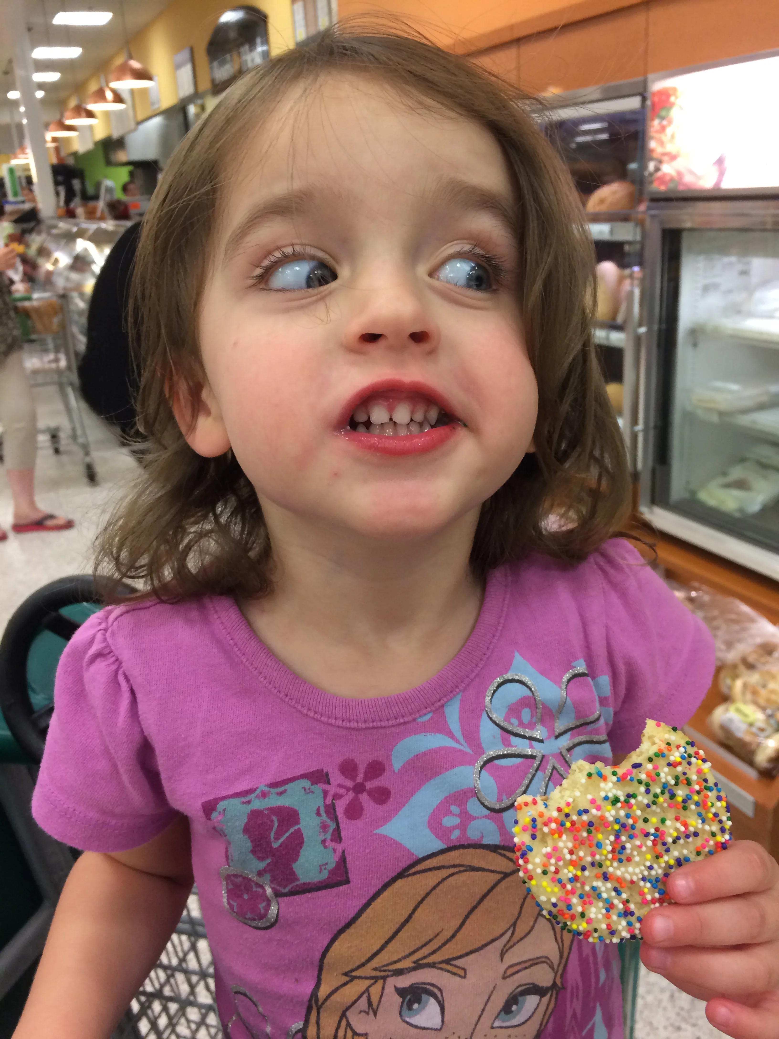 Alright, lady, gimme all the sprinkle cookies and I won't drive this cart into the bread display...