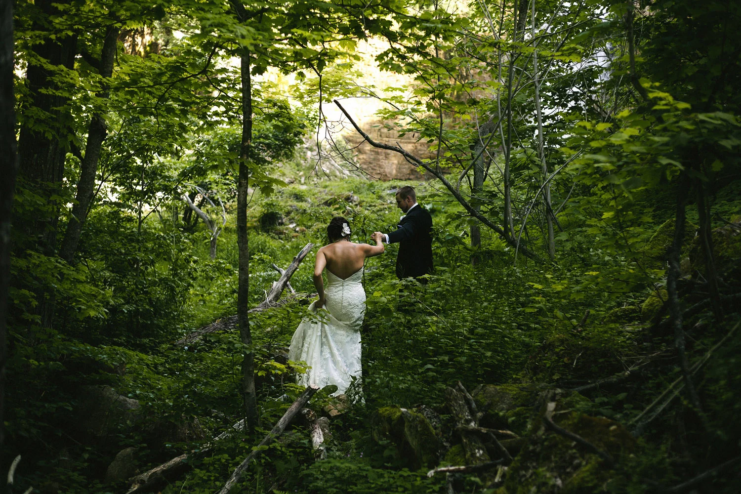 Bride and Groom adventure to waterfall at Walters Falls Inn