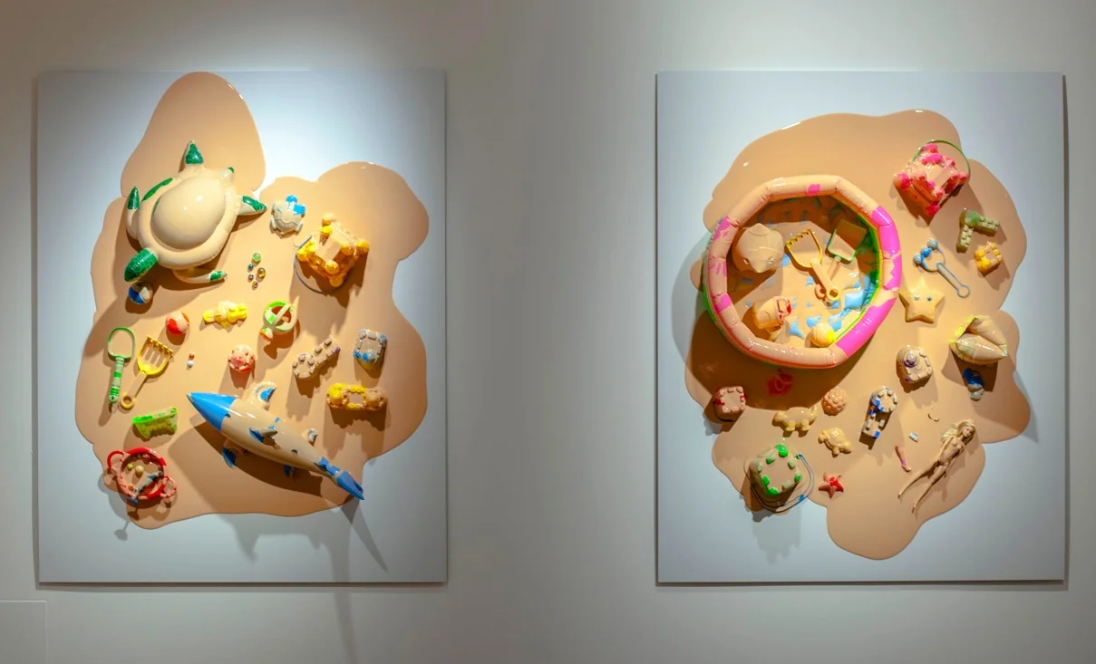  Part of the installation  In Limbo , these two panels titled  Cloud  are again an appropriation of childhood imagery.  Cloud  is made of coloured inflatable toys, plastic toys and flesh pigmented liquid silicone. Between image and reality these scen