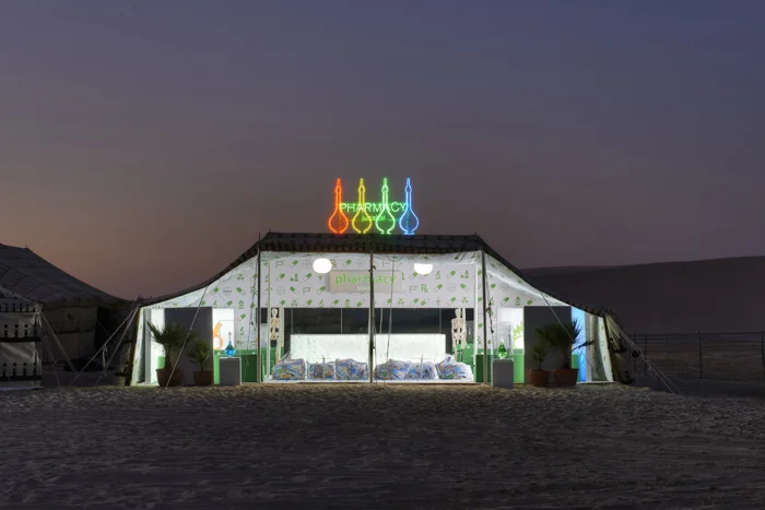 In the desert north of Doha, Qatar, “Prada Oasis,” along with the Pharmacy Juice Bar