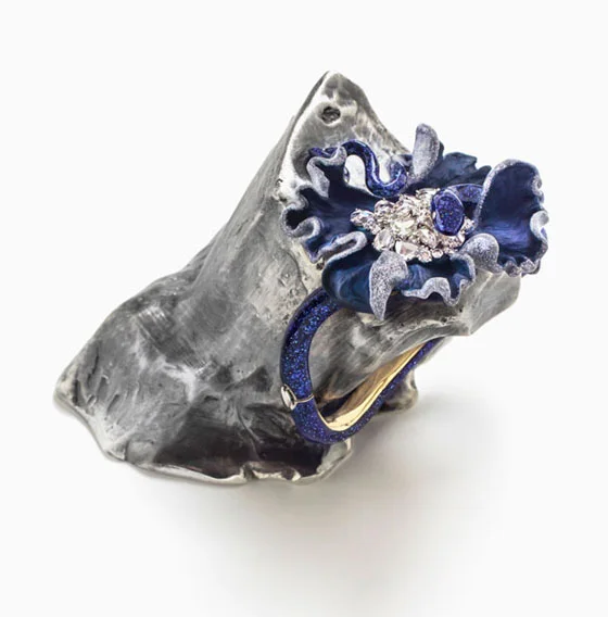 Lunae Lumen Glitter Blue, 2013, Y ellow and white gold, diamonds, colored lacquer, 3 9/16 x 2 3/4 x 3 15/16″
