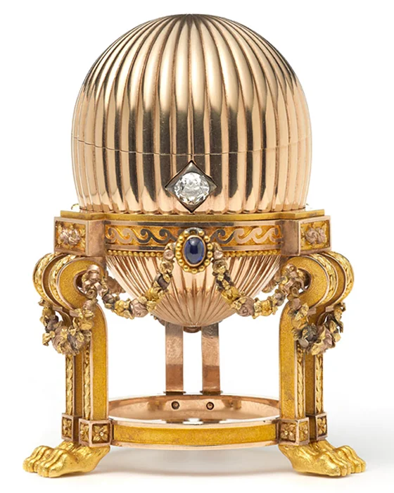 The 3.2-inch Faberge egg has three sapphires suspend golden garlands around it, and a diamond that acts as an opening mechanism.
