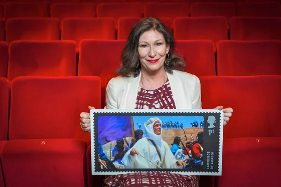 Actress Kate O'Toole in a familiar setting, with the newly-minted stamp honoring her father Peter O'Toole with a shot of him as Lawrence, his greatest role.
