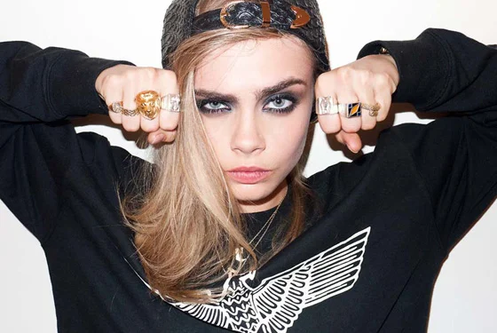 Cara Delevinge wearing Slim’s silver “Holy Cow Butt” rings