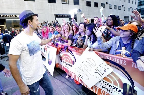 With fans in Rockefeller Center